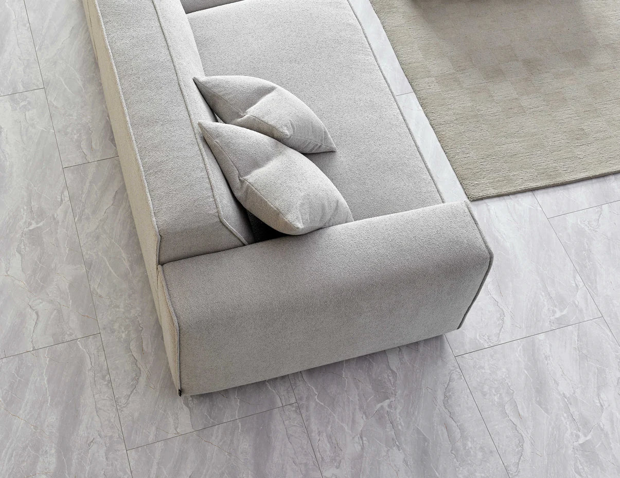 The Alaric 4 Seater Chaise Sofa in Pebble Boucle