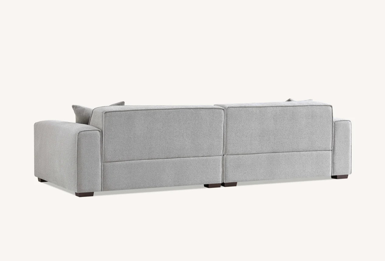 The Alaric 4 Seater Chaise Sofa in Pebble Boucle