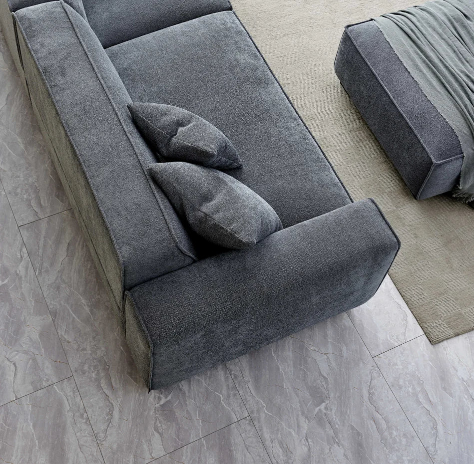 The Alaric 4 Seater Chaise Sofa in Charcoal Boucle