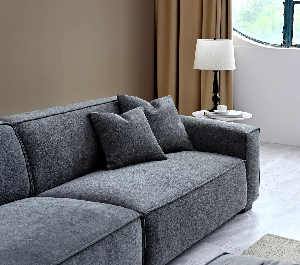 The Alaric 4 Seater Chaise Sofa in Charcoal Boucle