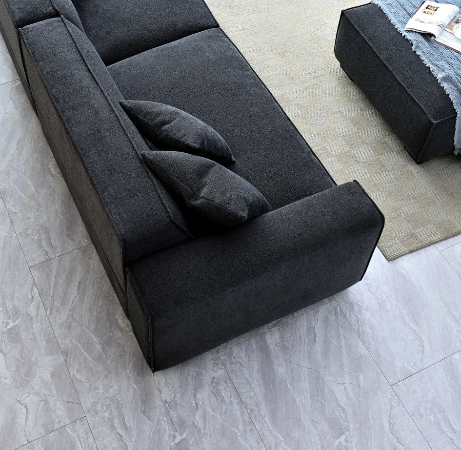 The Alaric 4 Seater Chaise Sofa in Mignight Boucle