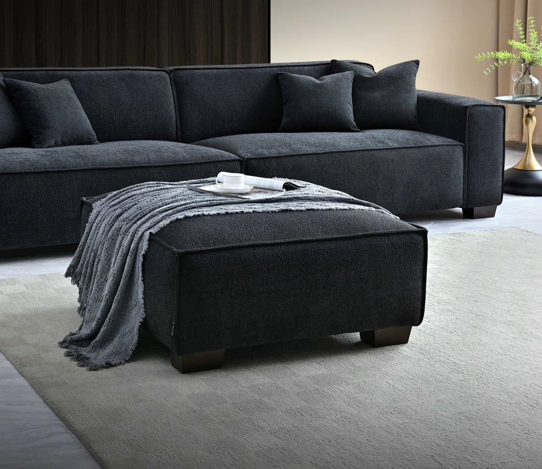 The Alaric 4 Seater Chaise Sofa in Mignight Boucle