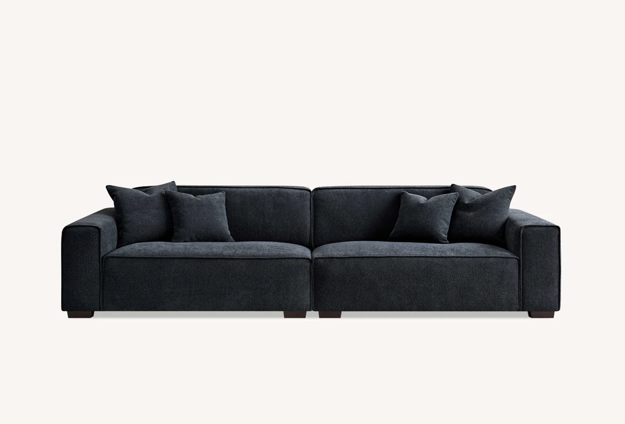 The Alaric 4 Seater Chaise Sofa in Mignight Boucle