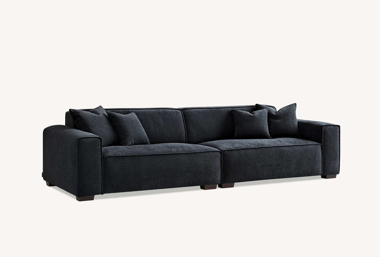 The Alaric 4 Seater Chaise Sofa in Mignight Boucle